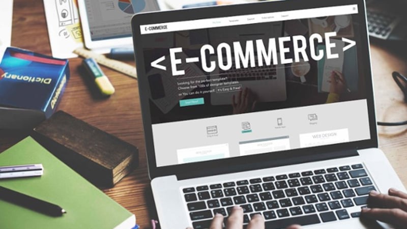 Laptop with the word 'E-Commerce' on the screen