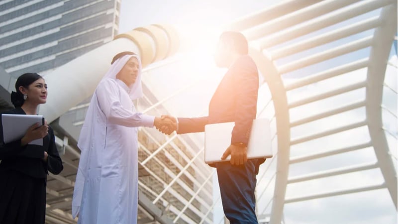 A handshake between to businessmen after a closed deal